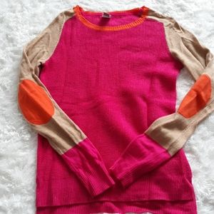 Bold color block sweater with elbow patches